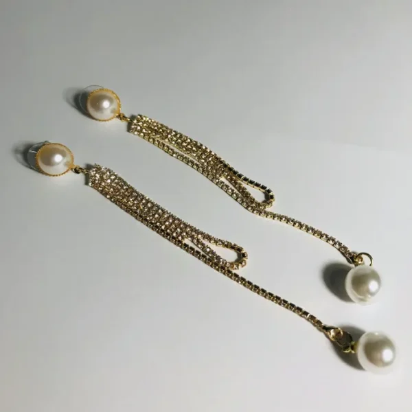 Long Pearl drop earrings with pearl pendulum style